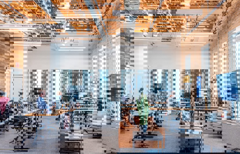 Interior commercial office space with staff working at desks