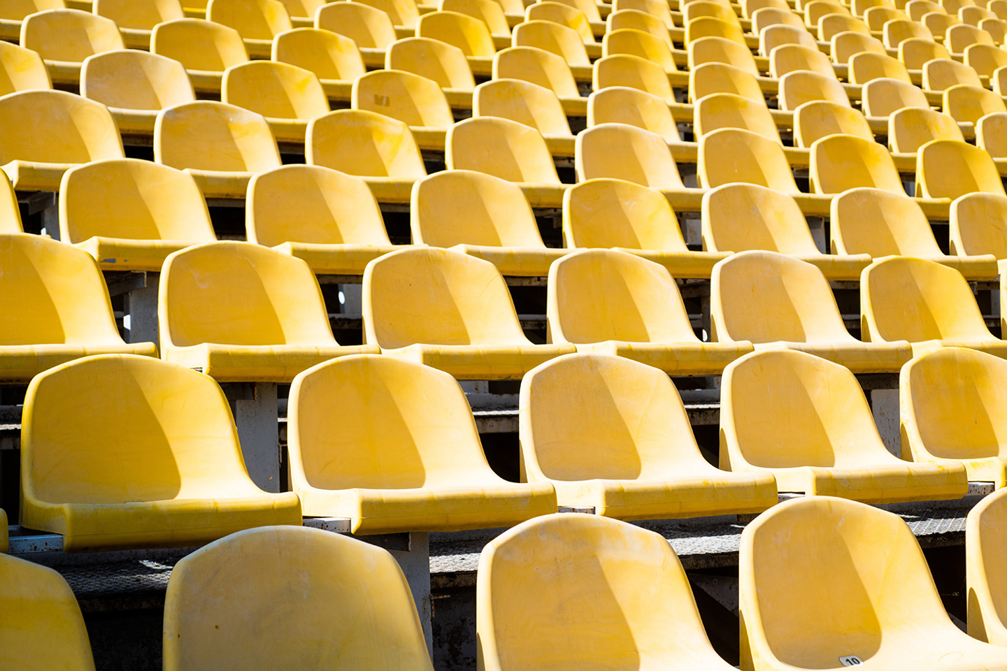 Empty yellow seats in a stadium