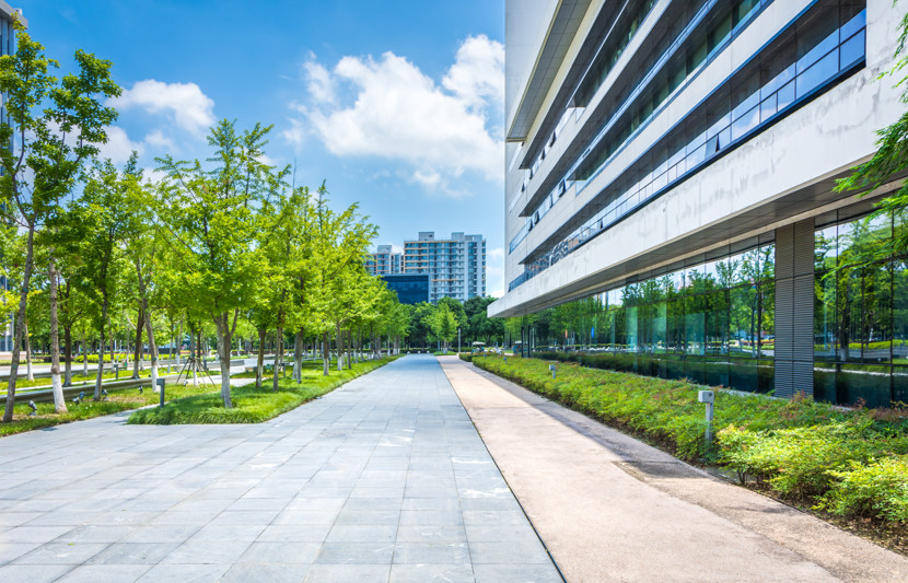Modern_Office_Building_Trees_AdobeStock_242290244.jpeg