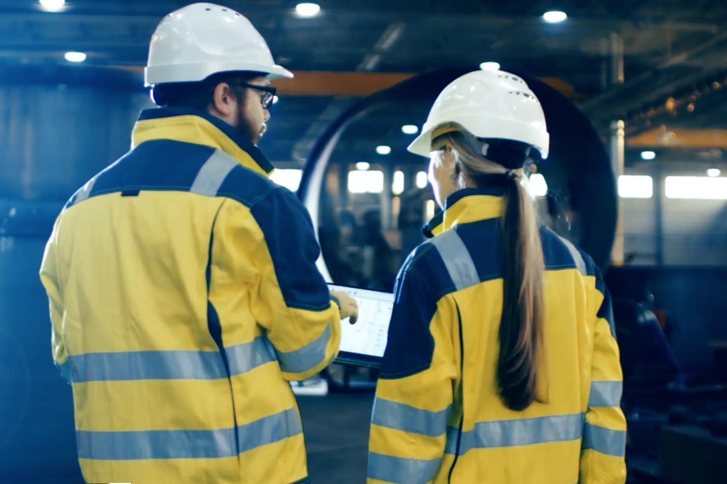 Two people conducting a health and safety assessment.
