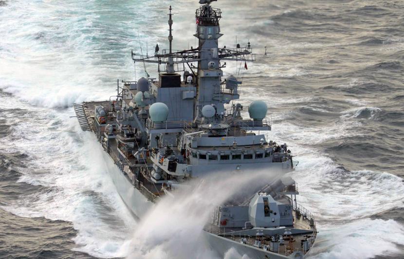 Maritime combat ship travelling in the sea.