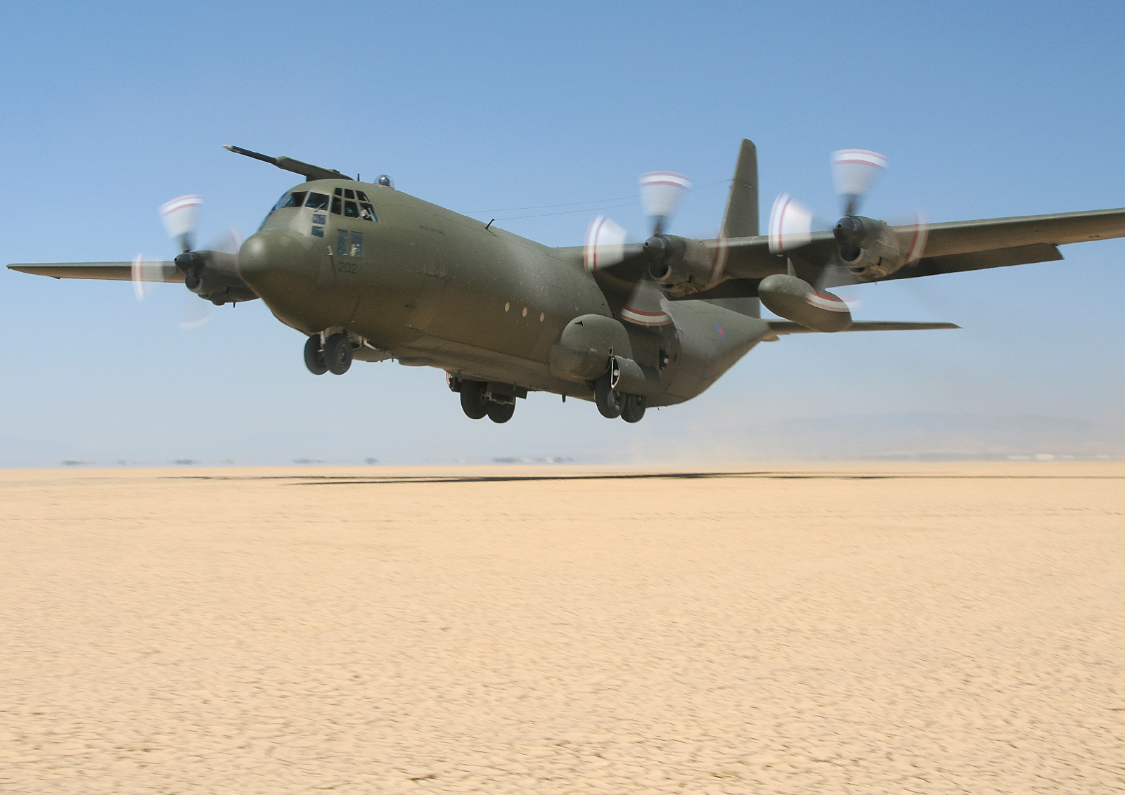 Aircraft in action over desert settings. 