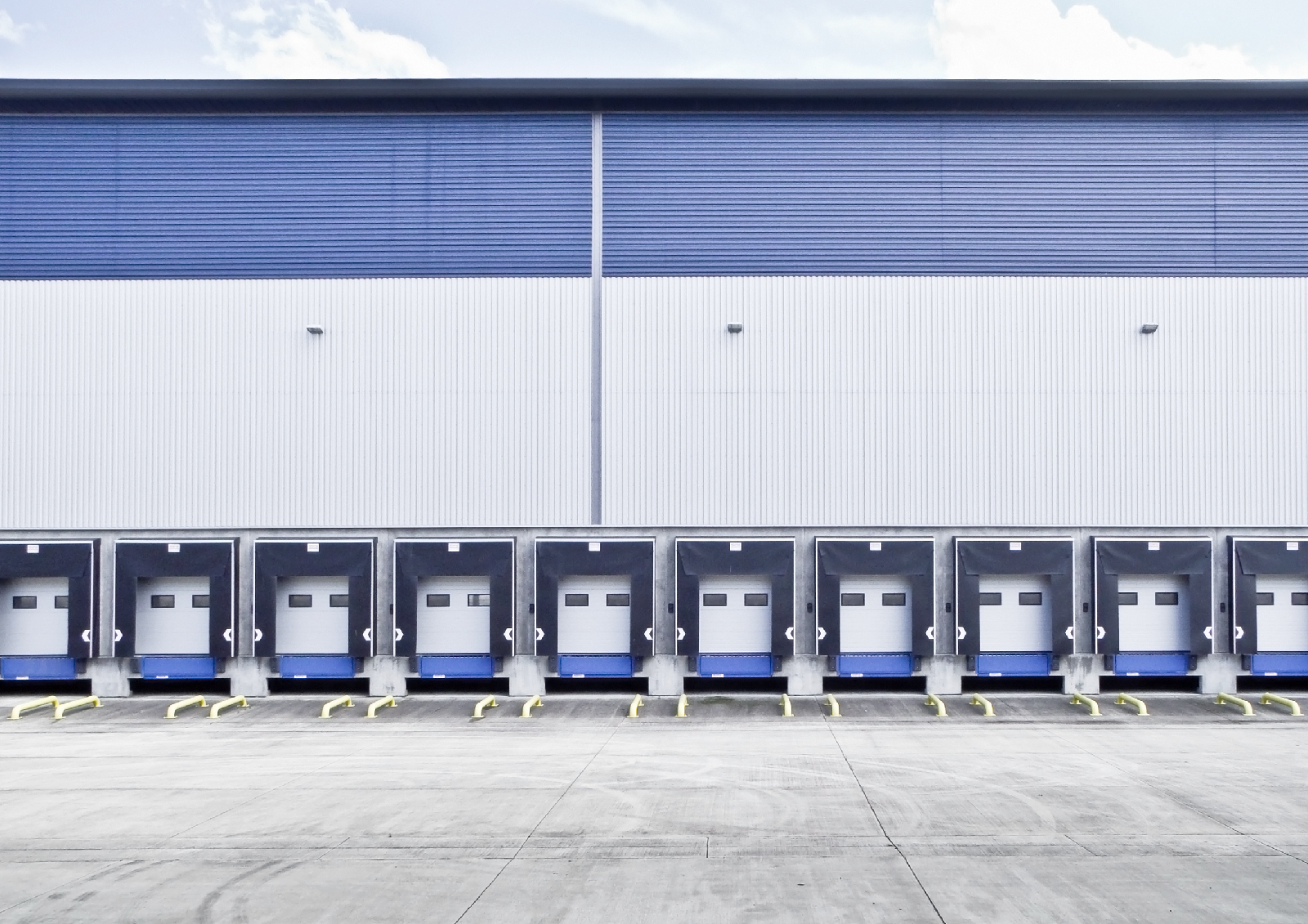 A logistics building showing multiple loading docks for lorries 