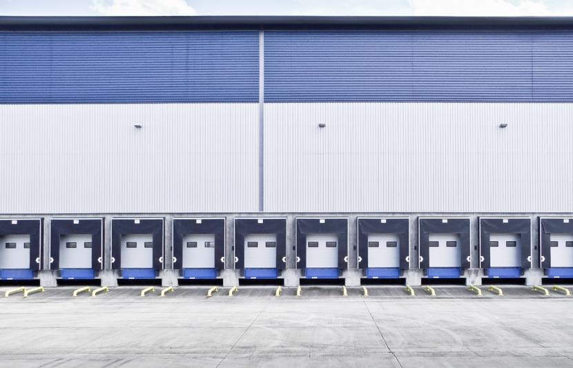 A logistics building showing multiple loading docks for lorries