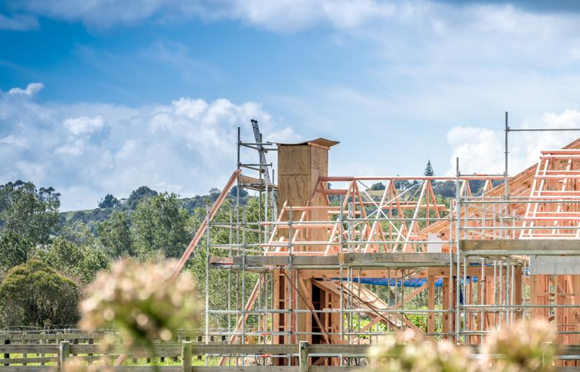 New build house in construction surrounded by green space