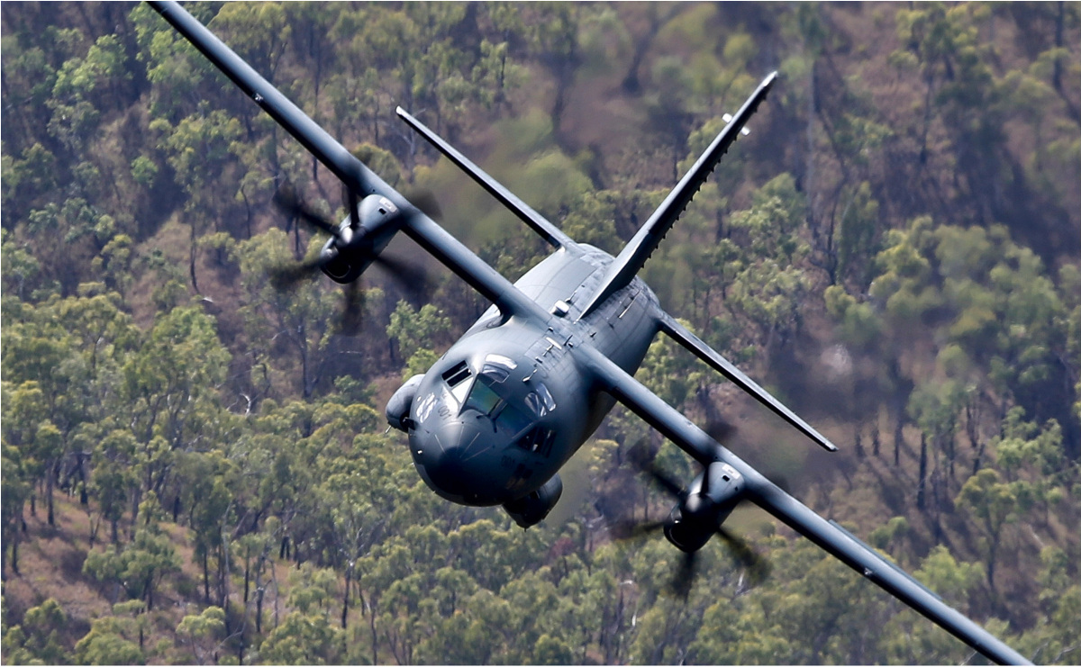 Royal Australian Air Force C-27J Spartan Battlefield Airlifters fleet in flight over bush
