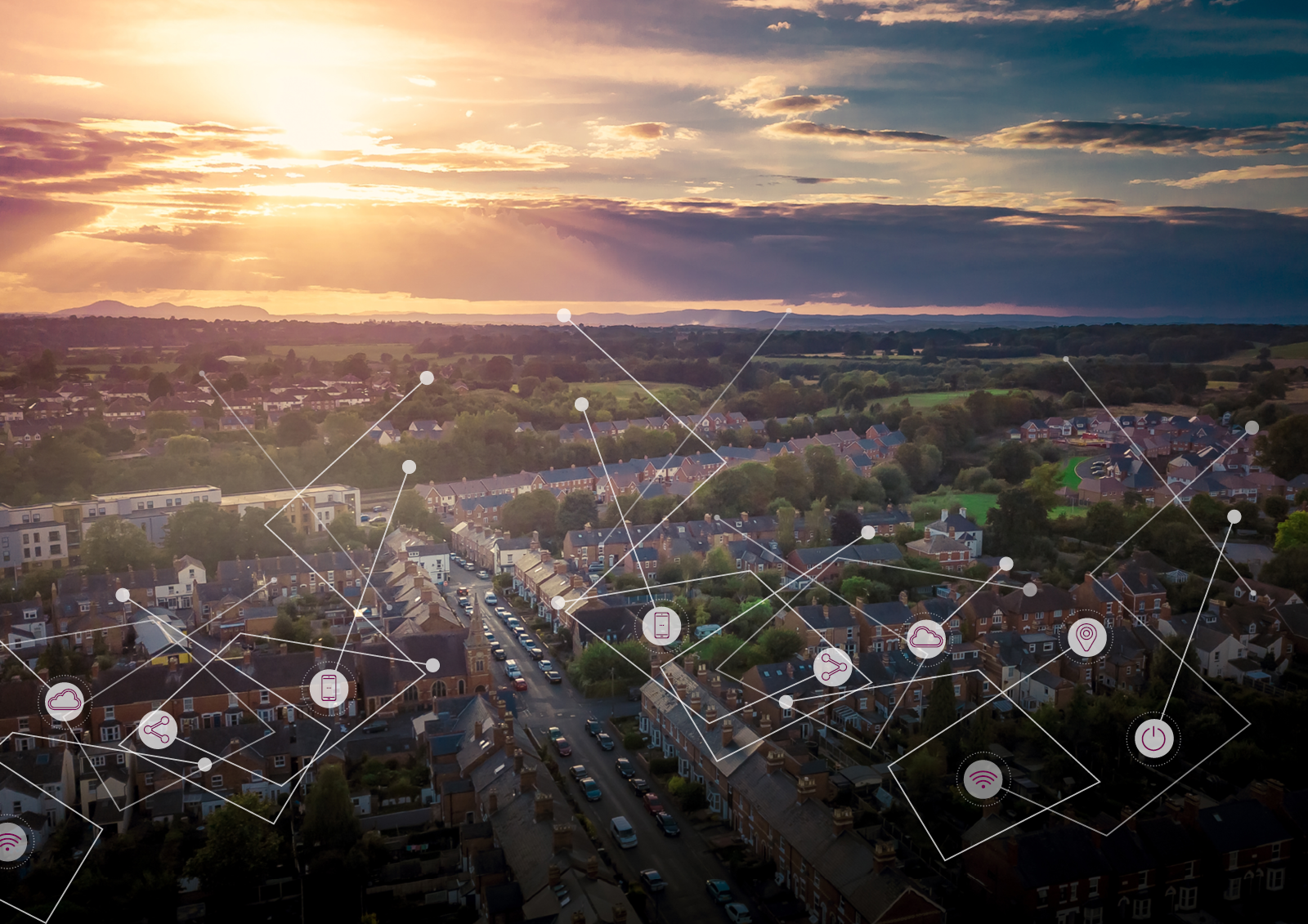 Aerial shot of a residential area and countryside at sunset with interconnected lines overlain