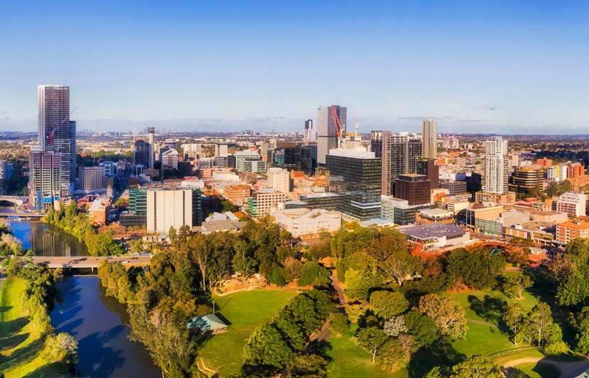 Western Sydney Parramatta CBD aerial panorama towards distant Sydney city CBD on the horizon.