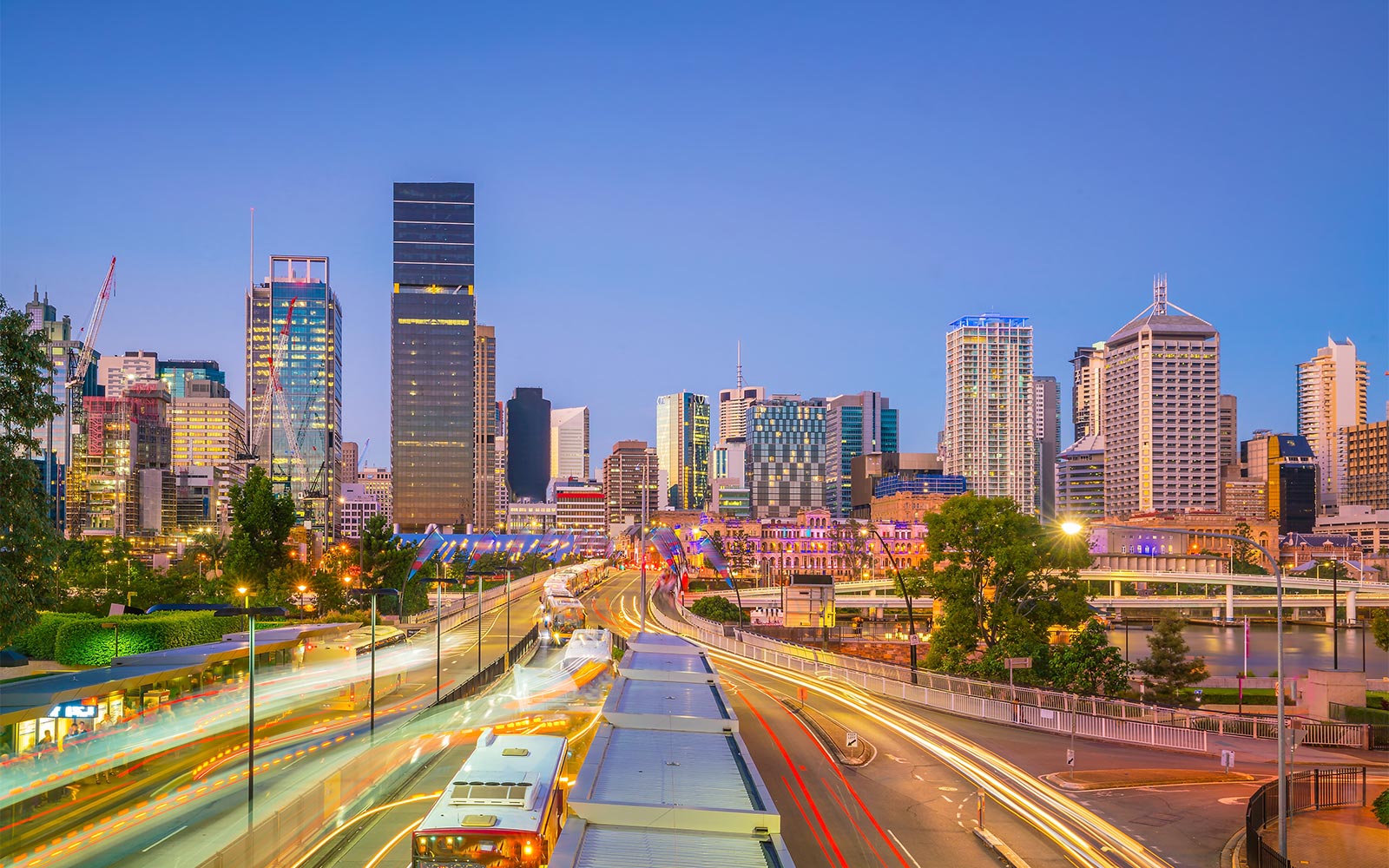 Brisbane motorway with city lights, infrastructure and fast flowing transport