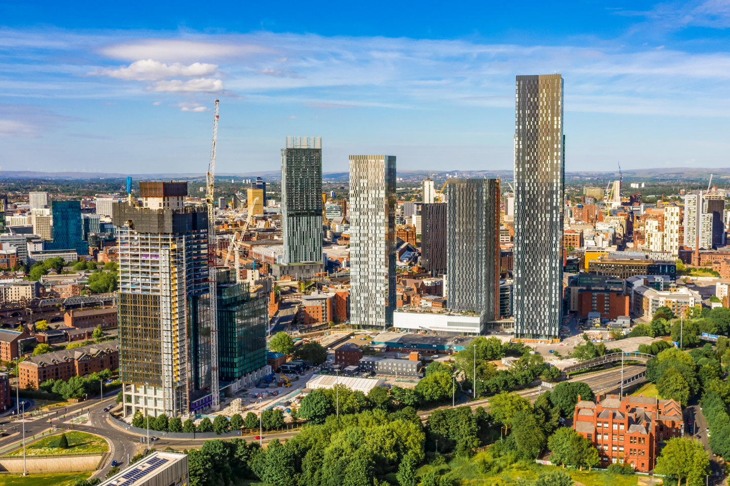 Landscape of tall buildings under construction in the city of Manchester