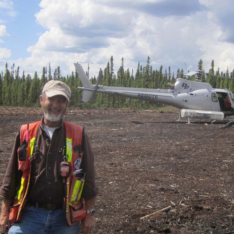 Bob Forbes Environmental Monitor with helicopter, in Saskatchewan, Canada
