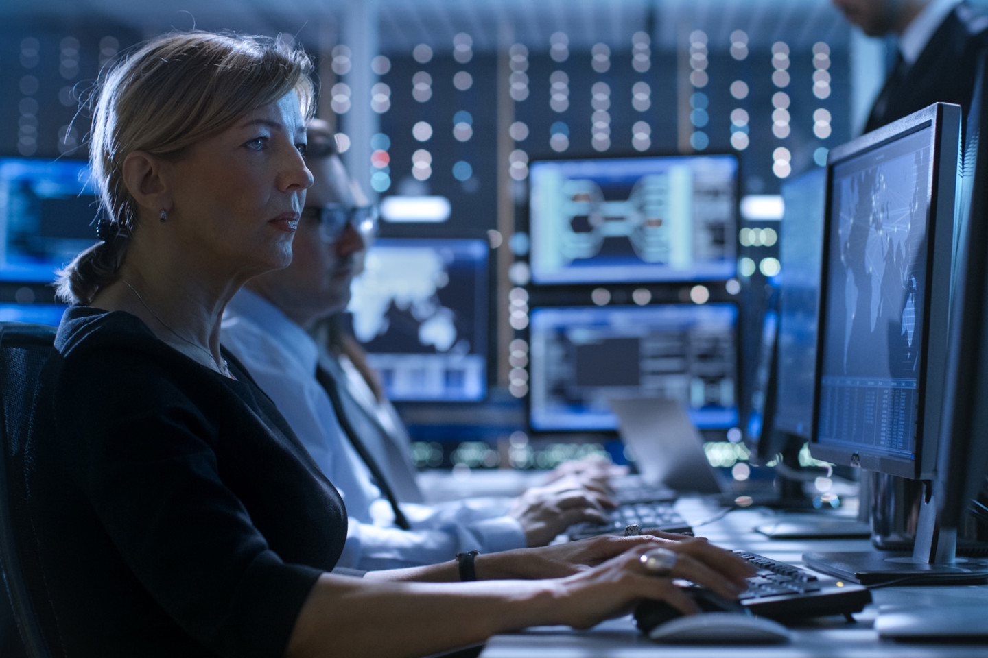 Workers accessing defence data systems using computers