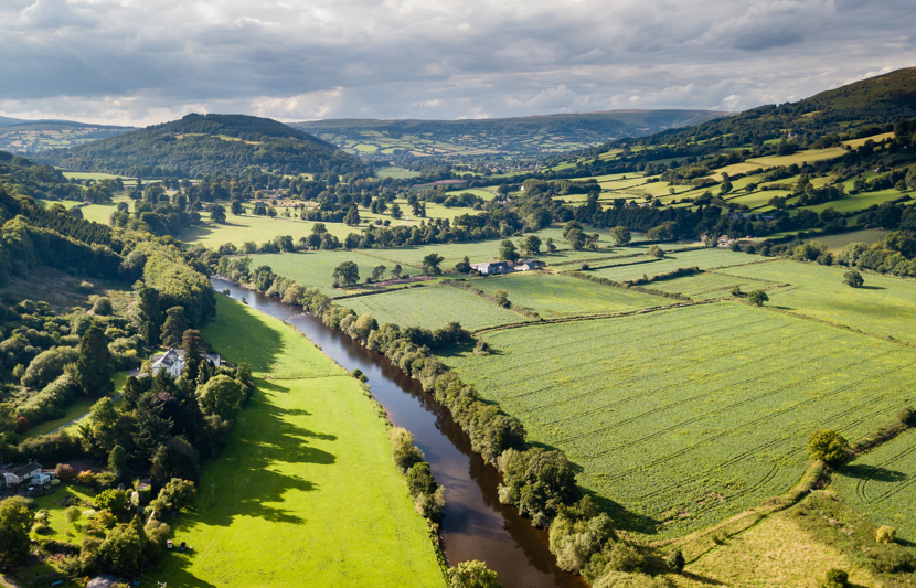 Landscape in the countryside of hills, a river and greenery