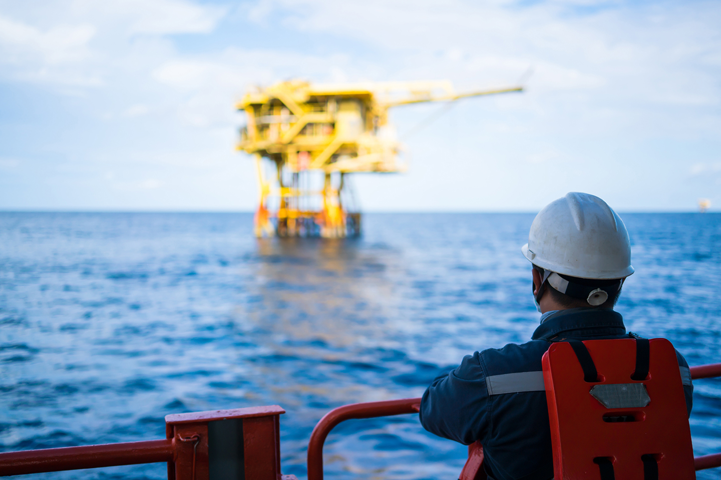 Worker Overlooking Offshore Oandg Platform
