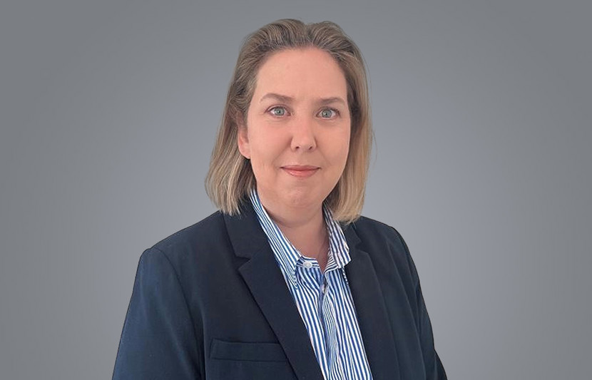 Kim Drubbel, Director - Strategy & Investment, RPS, wears blue suit and shirt in Perth office,