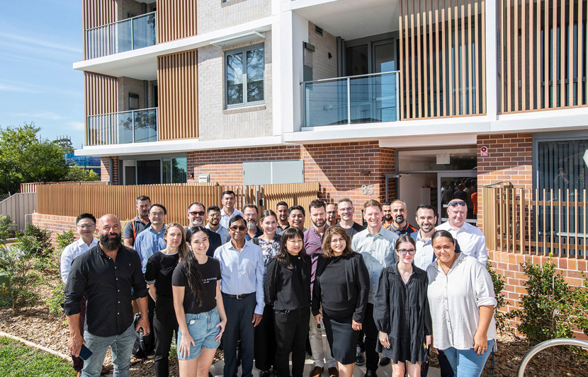 Project team standing in front of Waldron Road Chester Hill social housing development. Image credit: Homes NSW