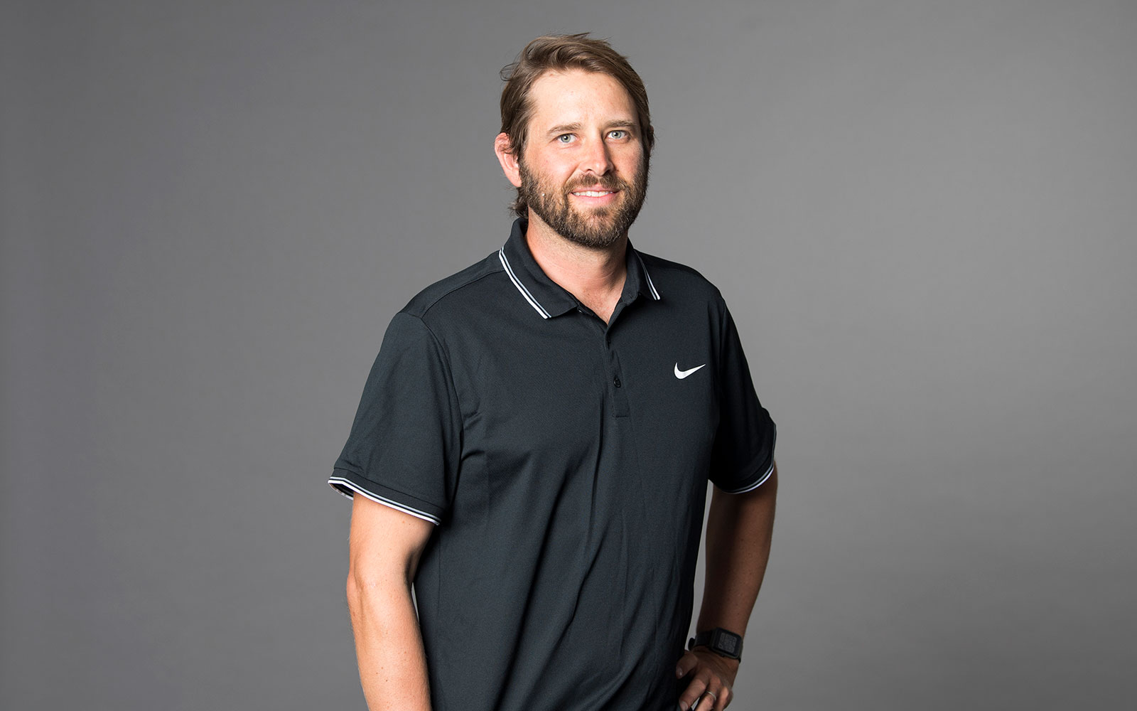 Mat Oski, RPS Principal Surveyor smiles at the camera wearing black polo shirt.