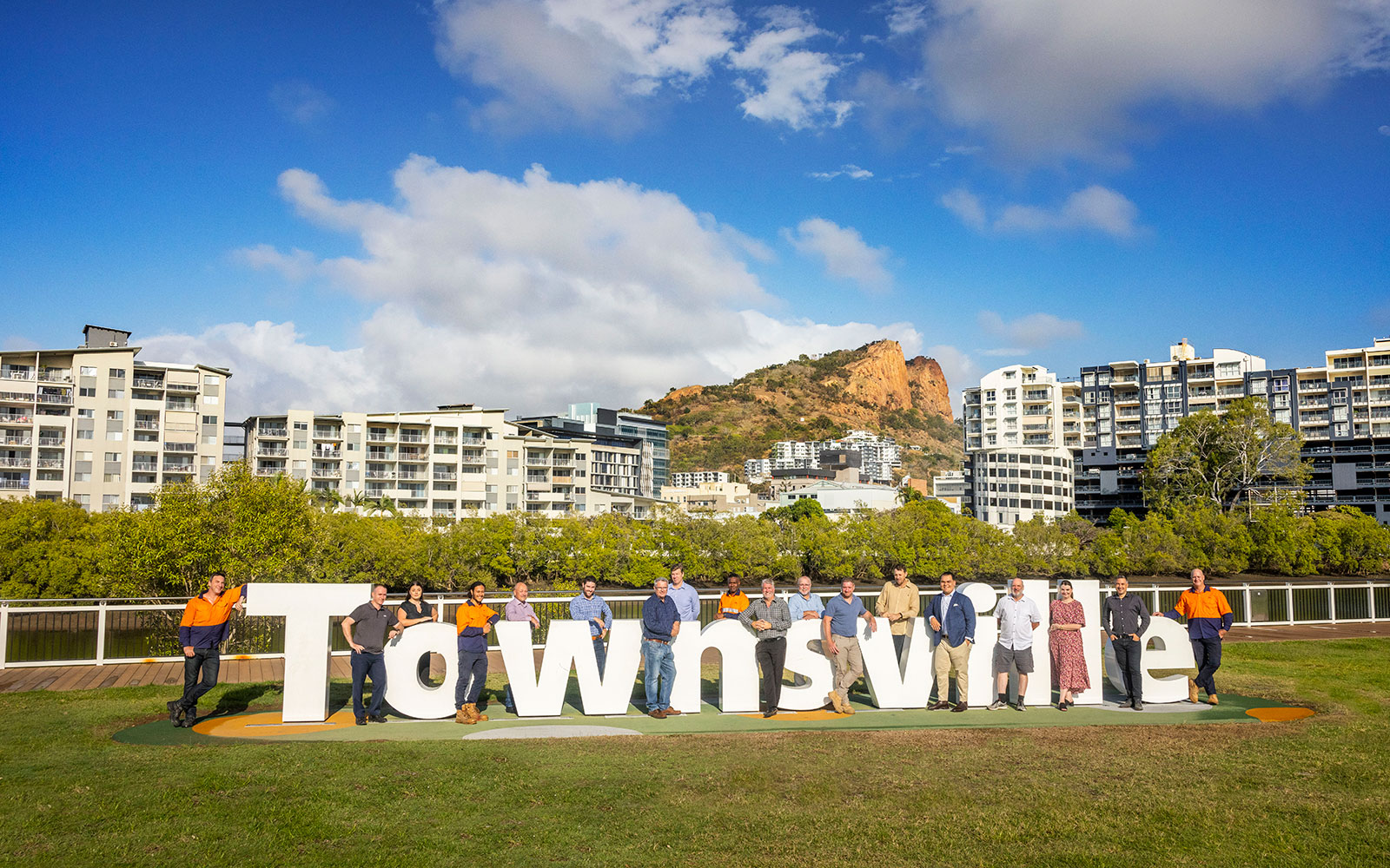 Townsville team standing around Townsville sign